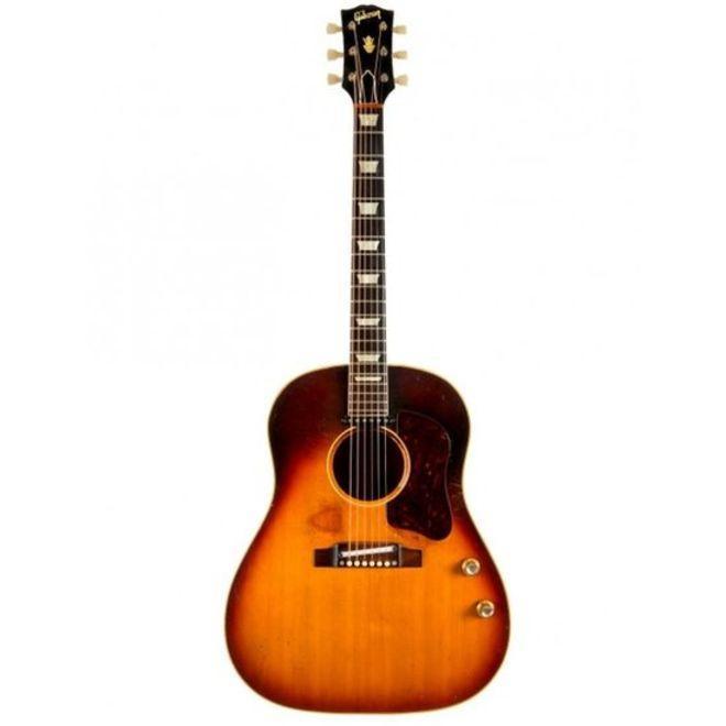 John Lennonın gitarı 2,4 milyon dolara satıldı