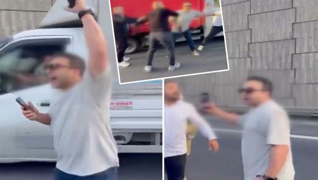 Trafikte korku dolu anlar! Polis memuru önünü kesip havaya ateş açtı)