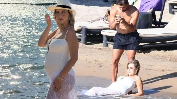 Caner Yıldırım'ın plajda zorlu mesaisi! Gamze Erçel'den Bodrum'da hamilelik pozları)