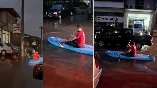 Sokaklar göle dönünce SUP tahtasıyla gezintiye çıktı!)