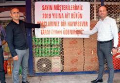 Veresiye defterini satın alıp, mahallelinin borçlarını ödedi