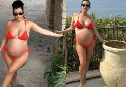 Karnı burnunda olan Kourtney Kardashian bikiniyle kamera karşısına geçti