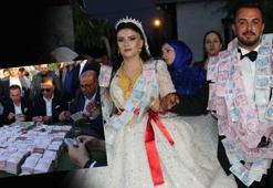 Aşiret düğününde geline takılan altın dudak uçuklattı, damada da servet takıldı