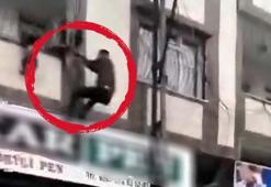 Balkon demirlerine asılı kalan 3 yaşındaki çocuğu vatandaş kurtardı! Korku dolu anlar kameralara yansıdı