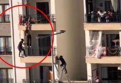 Balkondan düşmek üzere olan çocuğu böyle kurtardı!