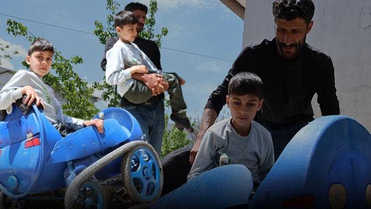 Baba olmak böyle bir şey Parasızlıktan alamadı, yürüme engelli oğluna plastik varilden araba yaptı